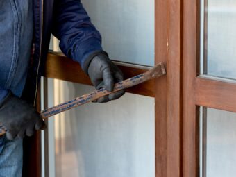 a-thief-trying-to-burden-a-window-door-with-the-cr-2023-11-27-05-03-53-utc