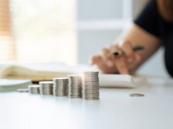Interest rate and dividend concept Businessman is calculating income and return on investment in percentage